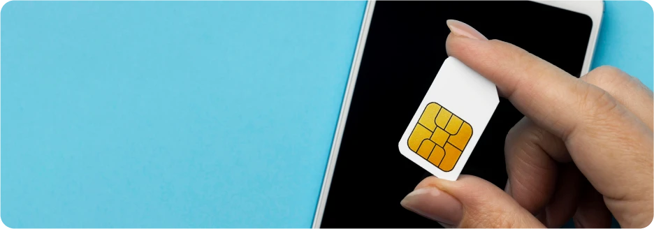 top-view-hand-holding-sim-card-with-smartphone
